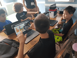 Summer camp kids learning coding